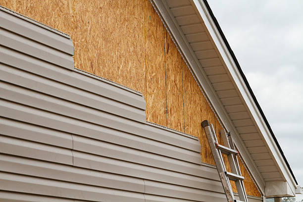 Professional Siding technician working in Georgetown, MA